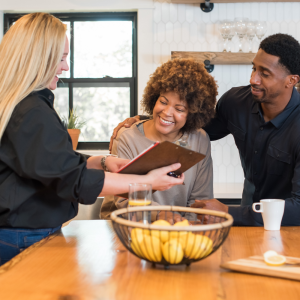 Couple speaking to a sales representative in their kitchen