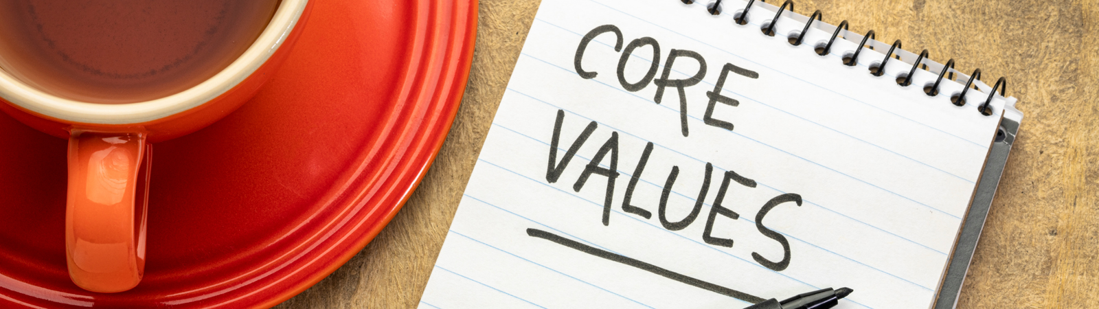 Header image of notebook that says "Core Values" written in it
